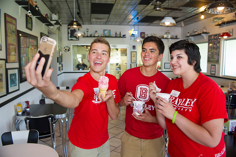 Students taking selfies