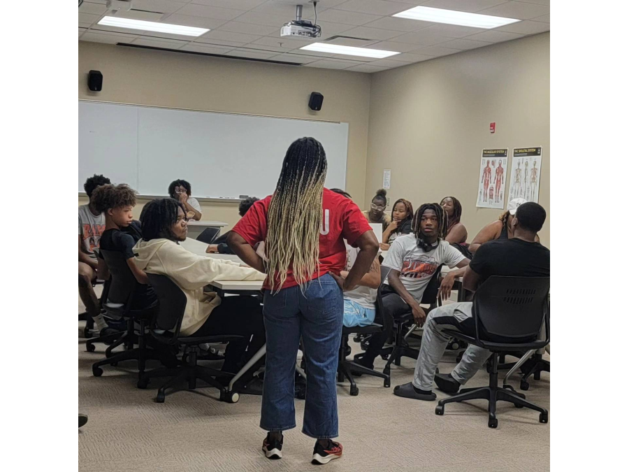 Dr. Sokonie Reed spends classroom time with GLOW students.