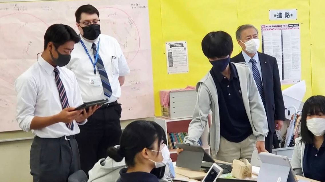 Students in classroom in Japan with American teacher