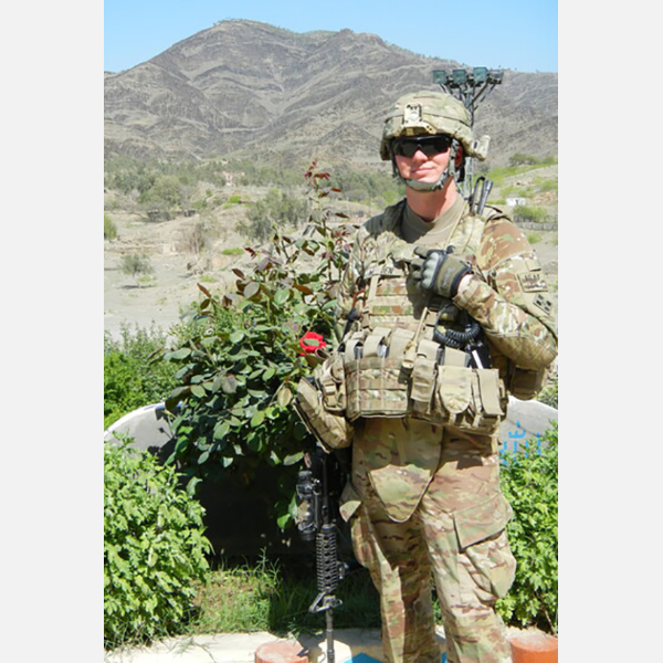 Photo of Major Sean Madden with all of his gear.