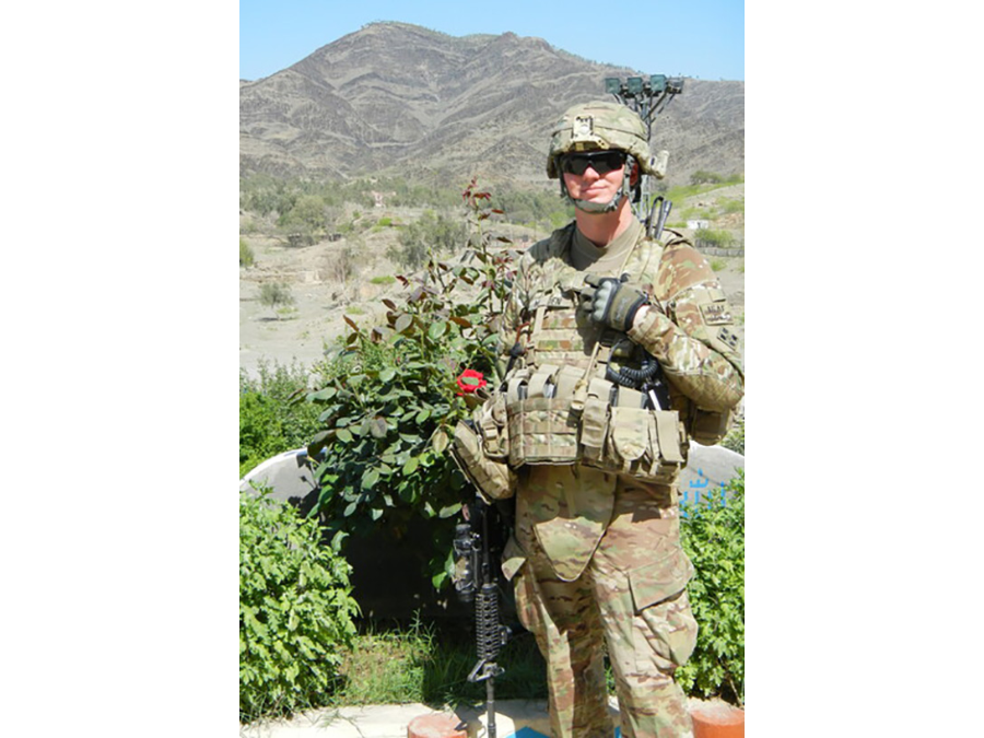 Photo of Major Sean Madden with all of his gear.